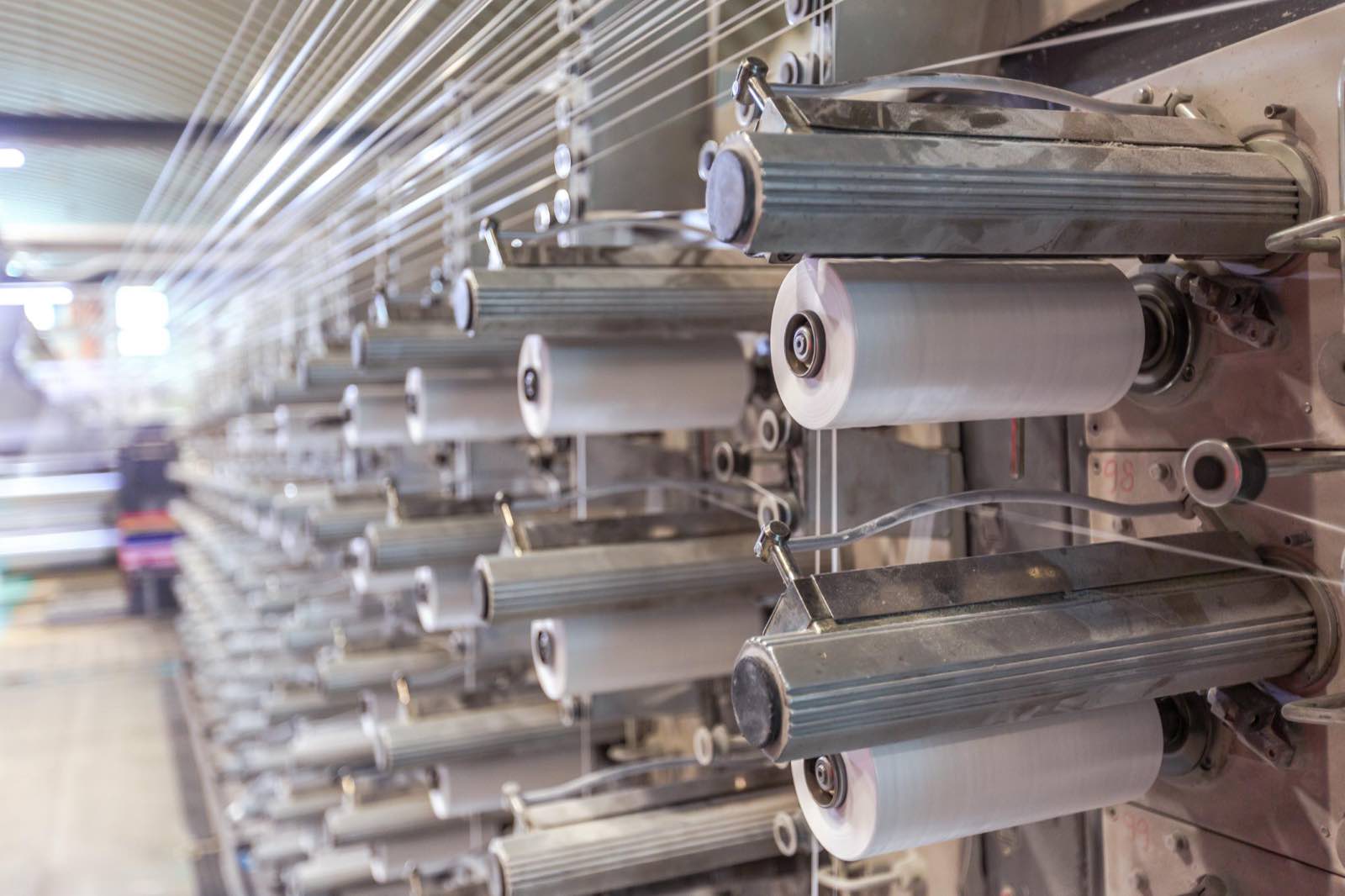 PP tape wound on bobbins, ready for the looms